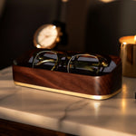 Dark Golden Hour Lifestyle Image of Italico Luxury Glasses Valet on a bedside table with glasses nested inside