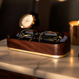 Dark Golden Hour Lifestyle Image of Italico Luxury Glasses Valet on a bedside table with glasses nested inside
